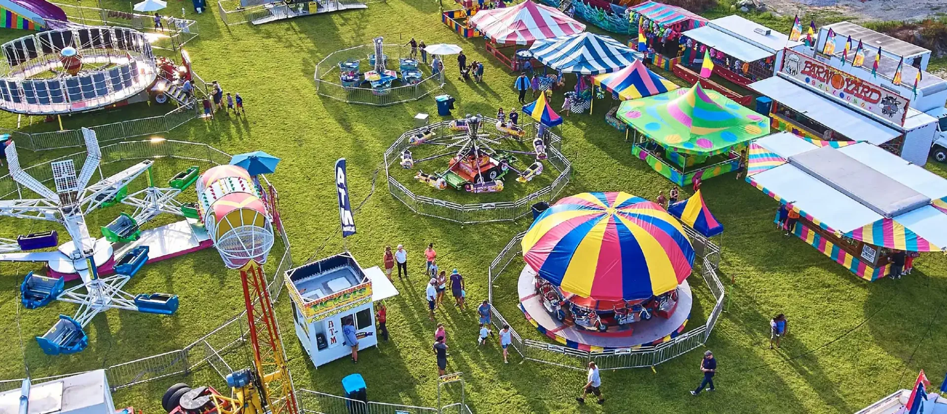 Aerial view of colorful carnival rides and attractions at Wvec West Valley Events Complex in Phoenix, Arizona.