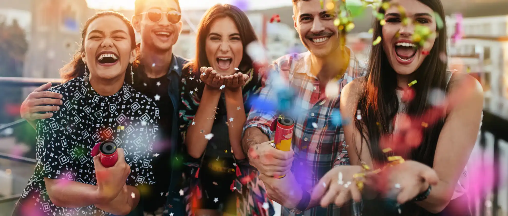 Group of friends celebrating with confetti at Wvec West Valley Events Complex in Phoenix, Arizona.